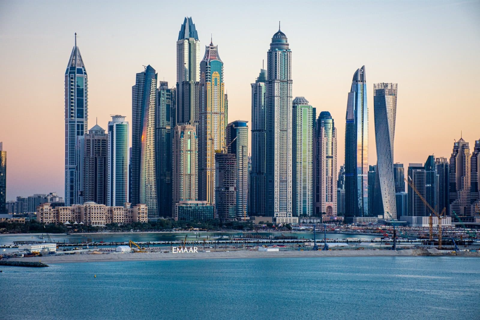 Dubai Marina skyline at dusk, seen from the beach