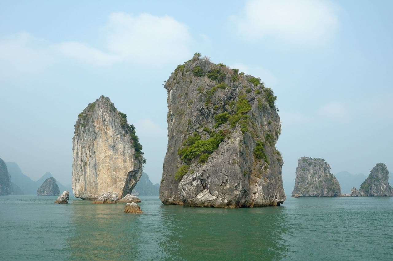 Limestone karsts rising from the water at Ha Long Bay, Vietnam