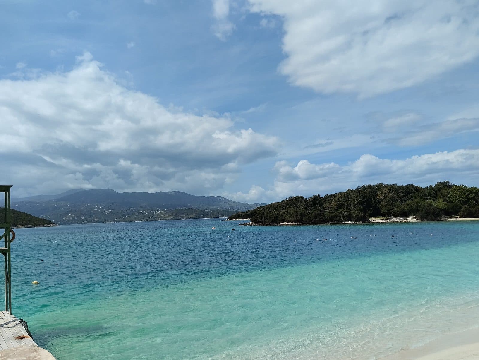 Clear turquoise water off Ksamil beach on the Albanian Riviera, with the Ksamil islets beyond